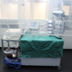 The perfusion machine while in operation, with the liver in the white container at left.